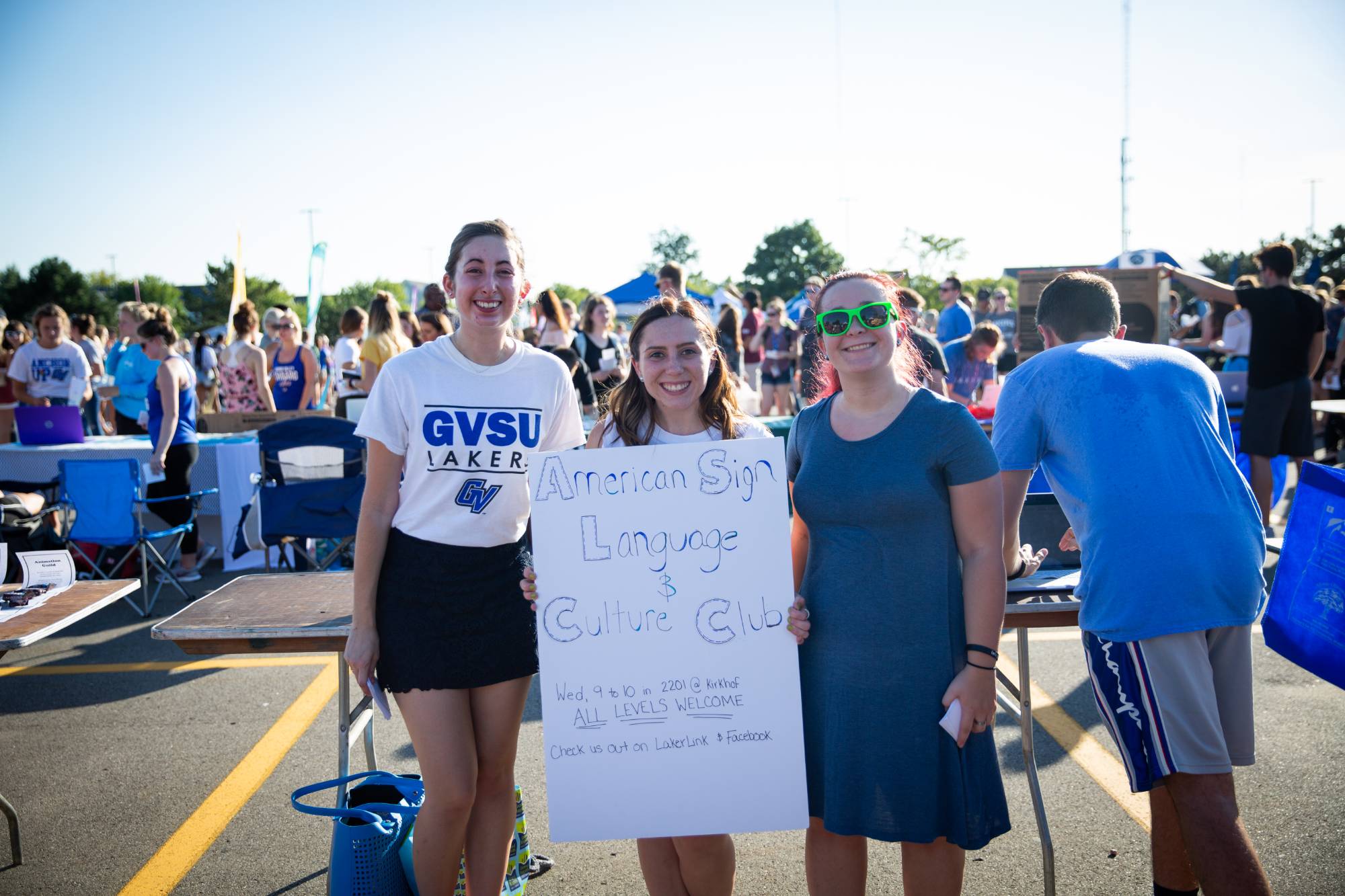 Student org members smiling at Campus Life Night